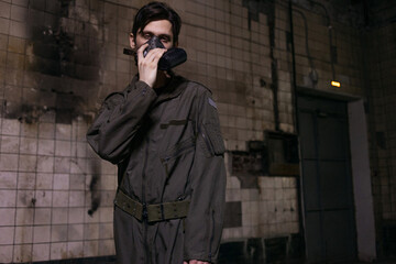 Gritty portrait of soldier in gas mask and tactical jumpsuit, post-apocalyptic warrior concept.