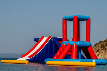 Water inflatable attraction on the seaside. Toy on the sea. 