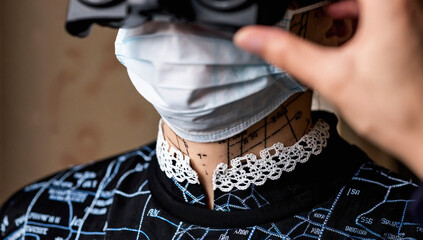 Person Wearing Face Mask, VR Headset, and Map-Printed Shirt