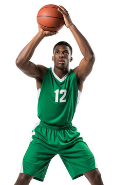 Determined young athlete in green jersey holding basketball ready to score