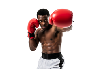 Muscular African American boxer in red gloves delivering a powerful punch with intense focus