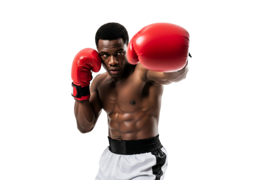 Muscular African American boxer in red gloves delivering a powerful punch with intense focus