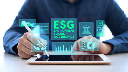 Person using a stylus on a tablet displaying an esg strategy with environmental social and governance icons and data visualizations