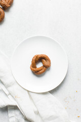 Overhead view of alkaki northern nigerian snack, top view of alkaki snack on a white plate, Hausa doughnut made with wheat and sugar paste or honey