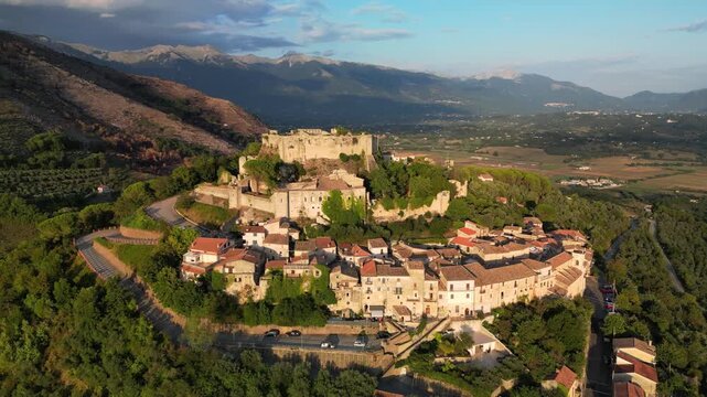 Village Vicalvi with the fortress atop the hill. Mountains of the Lazio region in the background.