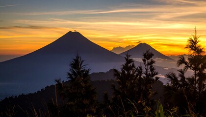 Silhouettes of Mount Merapi and Mount Muller in one composition