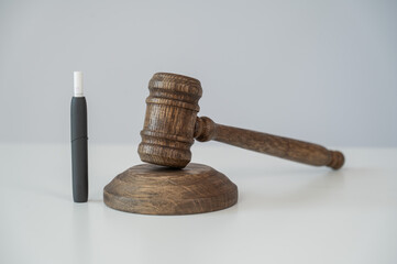 Judge's gavel and electronic cigarette. Tobacco heating system. 