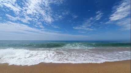 A serene beach scene with gentle waves and an empty shoreline, evoking tranquility.
