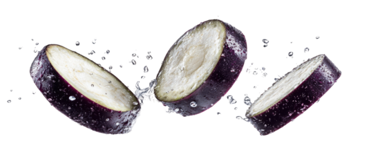 Sliced eggplant slices in mid-air, water droplets and splashes