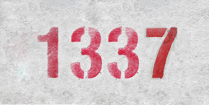 red spray-painted number 1337 sprayed onto a white wall.