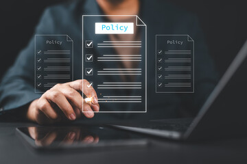 Businessman checking steps through a virtual online document with a list of checkboxes Concepts of...