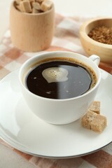 Aromatic instant coffee with sugar on light table, closeup