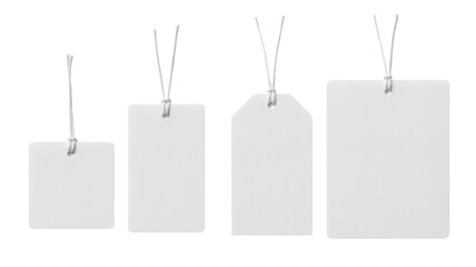 Four blank white tags with string, varying shapes and sizes