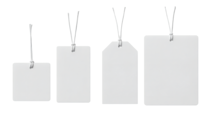 Four blank white tags with string, varying shapes and sizes
