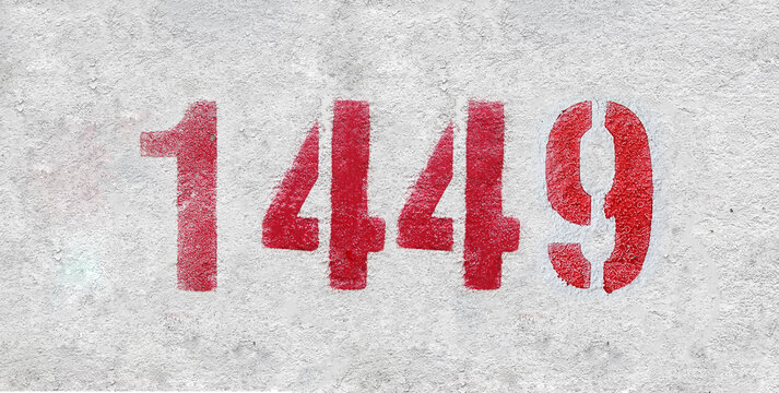 Red Number 1449 on the white wall. Spray paint.