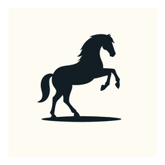 Vector art of a powerful black silhouette of a horse rearing up on its hind legs, isolated on a plain background
