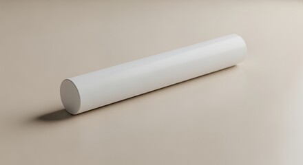 A sleek white cylindrical object rests on a neutral beige background, casting a subtle shadow.