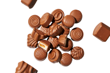 Assortment of milk chocolate candies isolated on transparent background