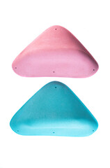 Pink and blue textured grips for indoor bouldering or training walls. Modern climbing holds with...