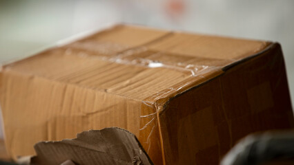 Cardboard boxes in warehouse, close-up, shallow depth of field