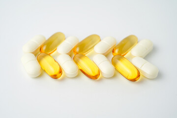 Clock made of pills capsules, pills form a circle, omega, vitamins, Cod liver oil, supplements