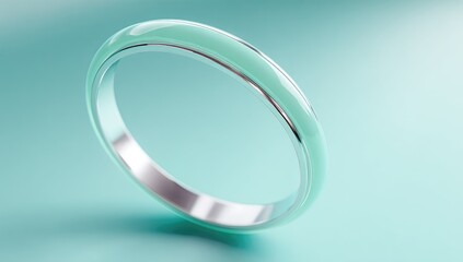 Sleek, pale green ring on a mint background