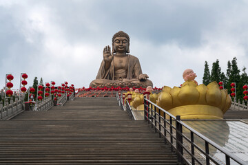The Great Buddha Statue in the Nanshan scenic area of the Jiaodong Peninsula on a sunny summer day, Longkou, Yantai, Shandong, China