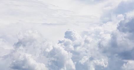 Vast Cloud Masses Stretching Across a Quiet Sky