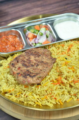 Nasi Kebuli, Indonesian variation of pilaf with Arabic rice influence, cook with goat, lamb or chicken, Spiced  with Clove, Cinnamon and garlic.