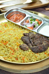 Nasi Kebuli, Indonesian variation of pilaf with Arabic rice influence, cook with goat, lamb or chicken, Spiced  with Clove, Cinnamon and garlic.