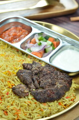Nasi Kebuli, Indonesian variation of pilaf with Arabic rice influence, cook with goat, lamb or chicken, Spiced  with Clove, Cinnamon and garlic.