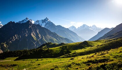 Majestic mountain range with snow-capped peaks and lush green valleys landscape