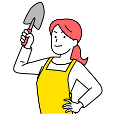 シャベルを構えるエプロン姿の女性