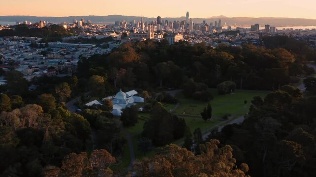 Aerial view of San Francisco's skyline, USA, at sunset. The Conservatory of Flowers is in Golden Gate Park. The city is a popular tourist destination.