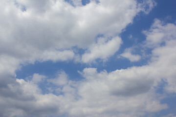 It's a blue sky with fluffy clouds.