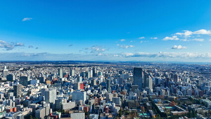 Drone aerial view of modern city and blue sky