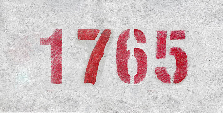 number 1765 . Red spray paint the white wall
