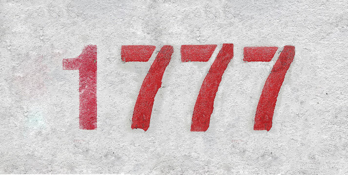 number 1777 . Red spray paint the white wall