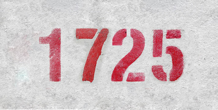 Red Number 1725 on the white wall. Spray paint.