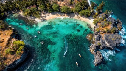Aerial view of a tropical cove with turquoise waters, sandy beach, rocky cliffs, and lush vegetation. Small boats dot the bay in the sunlit paradise