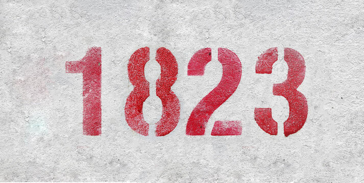 red spray-painted number 1823 sprayed onto a white wall.
