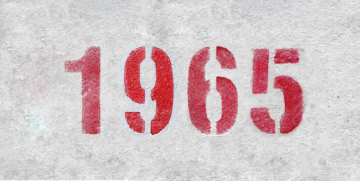 Red Number 1965 on the white wall. Spray paint.
