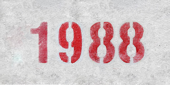 red spray-painted number 1988 sprayed onto a white wall.