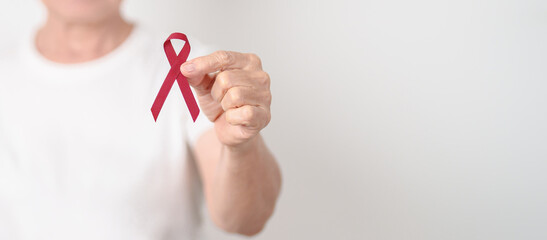 Elderly with Burgundy Ribbon for March Multiple Myeloma Cancer Awareness month, September Sickle Cell Anemia, Headache and Migraine week, April world Meningitis day, October Hospice  Palliative care