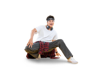 A young male dancer with a sporty look demonstrating breakdance moves. The dancer is crouched down on the ground while smiling.on png background