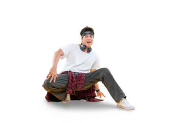 A young male dancer with a sporty look demonstrating breakdance moves. The dancer is crouched down on the ground while smiling.on png background