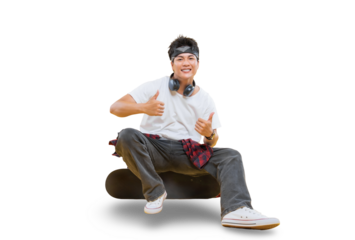 A young man happily giving the thumbs up while sitting on a skateboard on png background