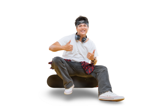 A young man happily giving the thumbs up while sitting on a skateboard on png background