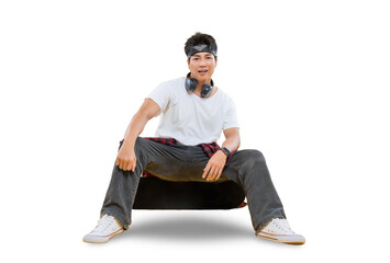 Young male with headphones and looking to the camera on the transparent background 