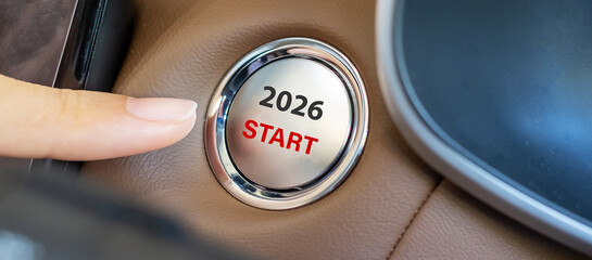 Finger press a car ignition button with 2026 START text inside  automobile. New Year New You, forecast, resolution, motivation, change, goal, vision, innovation and planning concept
